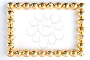 Border Made From Gold Baubles Against White Background