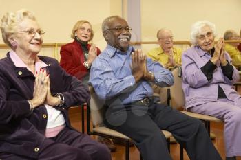 Royalty Free Photo of Seniors in a Stretching Class