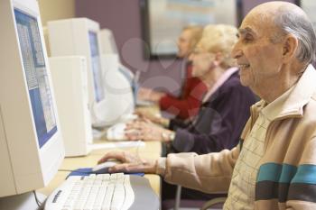 Royalty Free Photo of Seniors Using Computers
