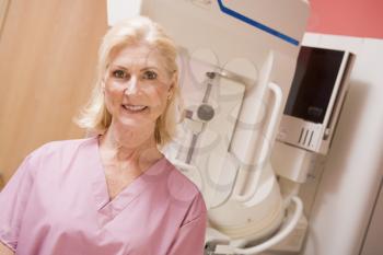 Royalty Free Photo of a Woman With a Mammogram Machine