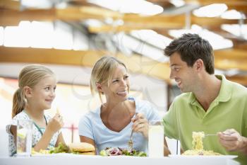 Royalty Free Photo of a Family Having Lunch at a Mall