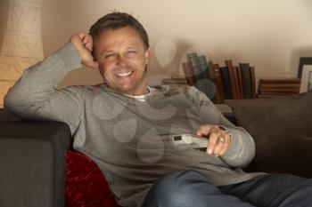 Royalty Free Photo of a Man With a Remote Control
