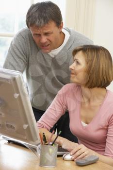 Royalty Free Photo of a Couple Using a Computer
