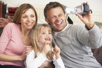 Royalty Free Photo of a Family Filming Themselves