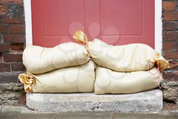 Royalty Free Photo of Sandbags Piled Against a Door