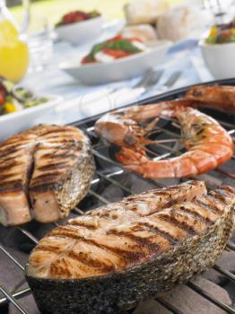 Royalty Free Photo of Salmon and Prawns on a Grill