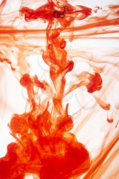 Royalty Free Photo of Red Ink Mixing in Water