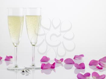 Royalty Free Photo of Champagne Glasses and Rose Petals