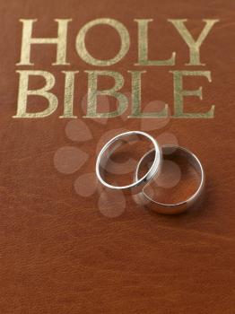 Royalty Free Photo of Wedding Rings on a Bible