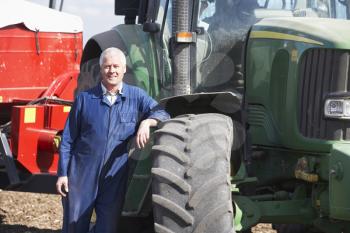Royalty Free Photo of a Man With a Tractor