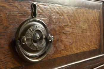 Royalty Free Photo of a Closeup of an Antique Dresser Handle