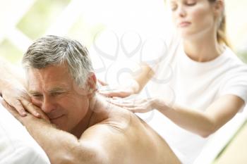 Royalty Free Photo of a Man Getting a Massage