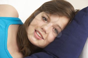 Royalty Free Photo of a Girl on a Pillow