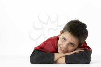 Royalty Free Photo of a Boy Lying on His Stomach