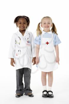 Royalty Free Photo of Young Children in Doctor's Clothes
