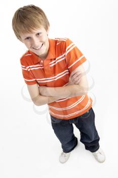 Royalty Free Photo of a Boy Standing With Arms Crossed