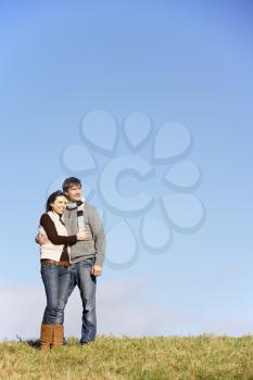 Royalty Free Photo of a Couple Standing Outside