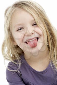 Royalty Free Photo of a Girl Sticking Her Tongue Out