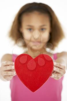 Royalty Free Photo of a Little Girl Holding a Heart