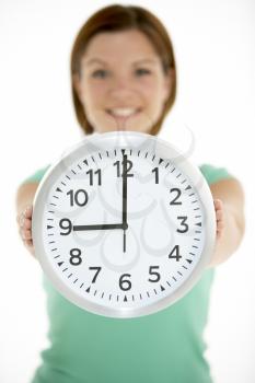 Royalty Free Photo of a Woman Holding a Clock