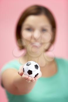 Royalty Free Photo of a Woman Holding a Soccer Ball