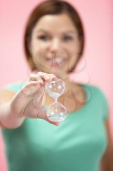 Royalty Free Photo of a Woman Holding an Hourglass