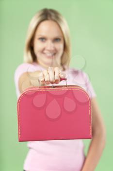 Royalty Free Photo of a Girl Holding a Suitcase