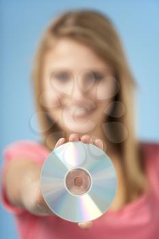Royalty Free Photo of a Teenage Girl With a DVD