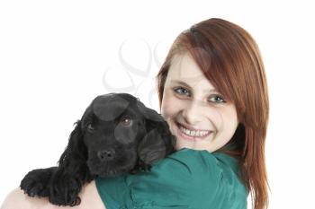 Royalty Free Photo of a Girl With a Puppy