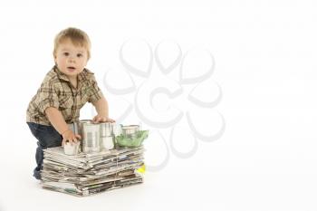 Young Boy Recycling In Studio