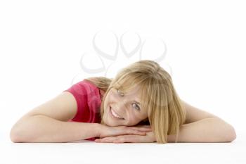 Royalty Free Photo of a Girl Lying on the Floor