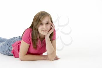 Royalty Free Photo of a Girl Lying on Her Stomach on the Floor
