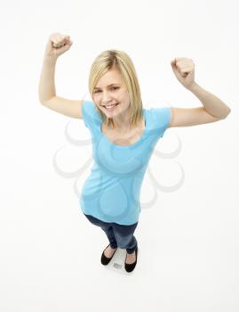 Royalty Free Photo of a Young Girl With Her Fists Raised