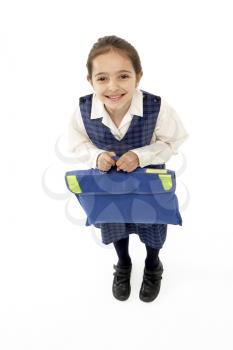 Studio Portrait of Smiling Girl Holding School Bag