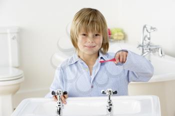Royalty Free Photo of a Little Boy Brushing His Teeth