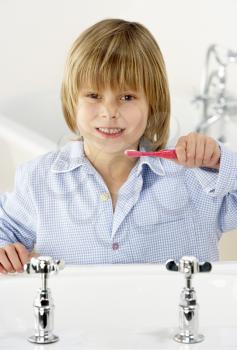 Royalty Free Photo of a Little Boy Brushing His Teeth