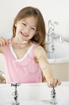 Royalty Free Photo of a Little Girl Brushing Her Teeth