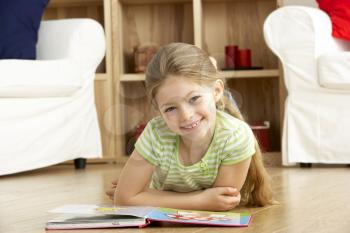 Royalty Free Photo of a Little Girl Reading a Book
