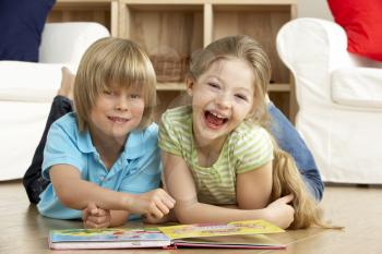 Royalty Free Photo of Two Children Reading