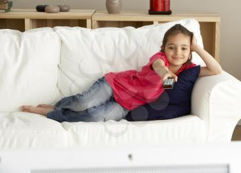 Royalty Free Photo of a Little Girl Watching Television