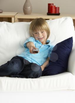 Royalty Free Photo of a Little Boy Watching Television