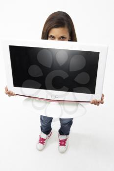 Portrait of Smiling Teenage Girl Holding Television