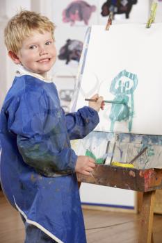Royalty Free Photo of a Little Boy Painting