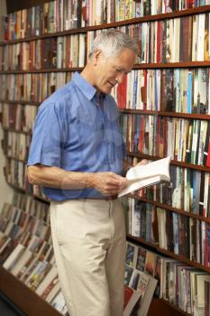 Royalty Free Photo of a Man in a Bookshop