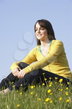 Royalty Free Photo of a Young Girl in a Field of Buttercups
