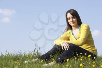 Royalty Free Photo of a Girl in Field of Buttercups