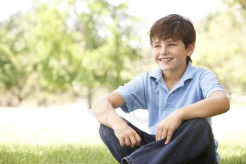 Royalty Free Photo of a Boy on the Grass