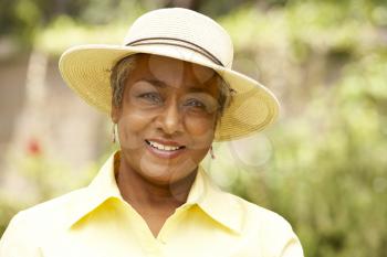 Royalty Free Photo of a Woman in a Straw Hat