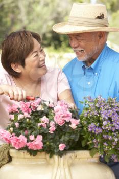 Royalty Free Photo of a Man and Woman With Flowers