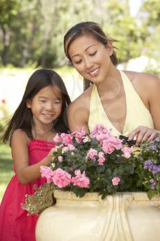 Royalty Free Photo of a Mother and Daughter in a Garden